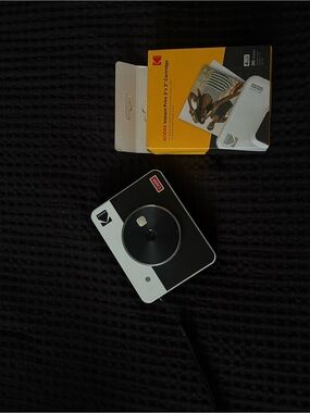 Kodak Instant Camera in Black and White with Yellow Film Box